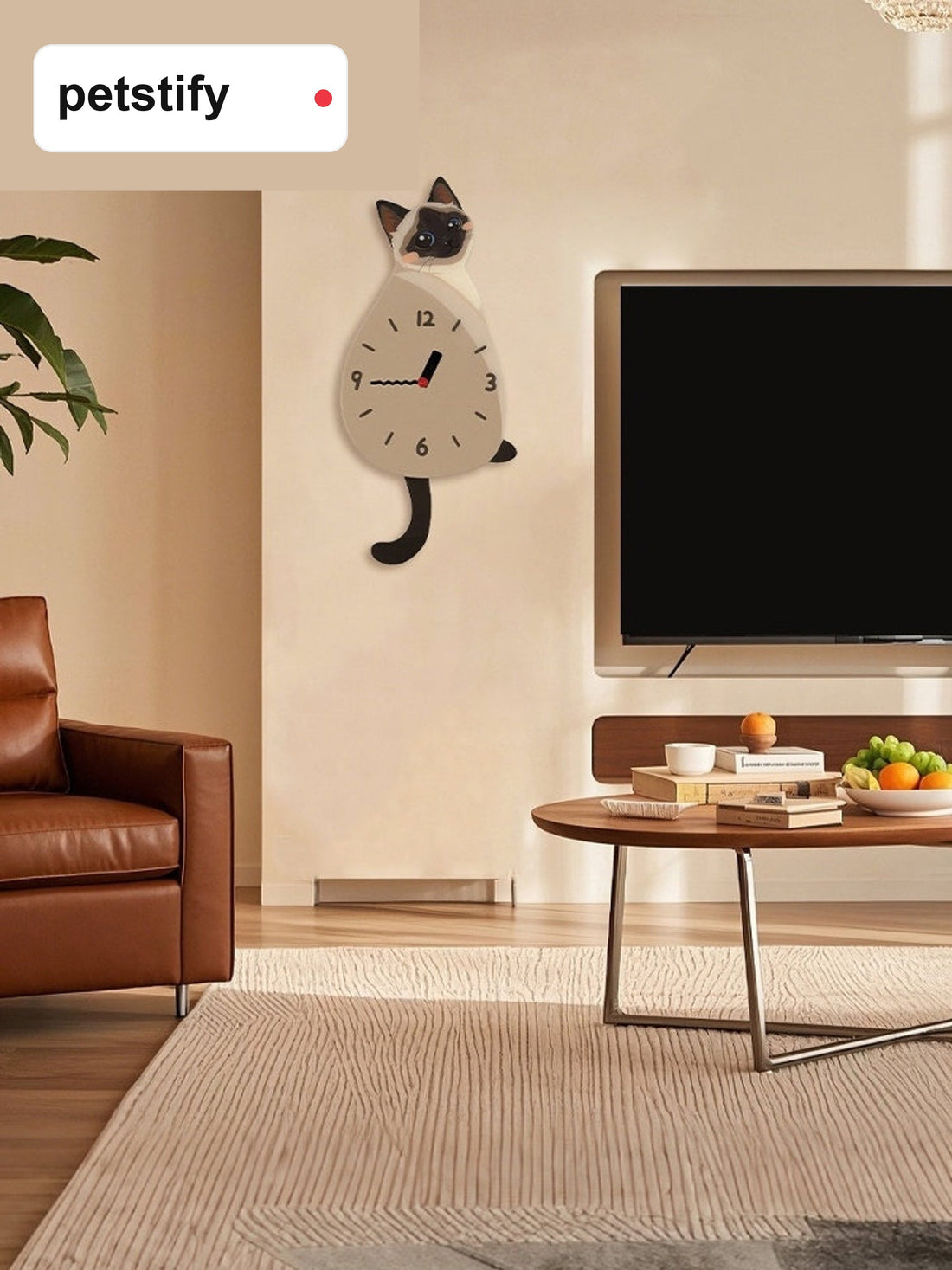 Siamese cat swinging-tail wall clock in a home interior