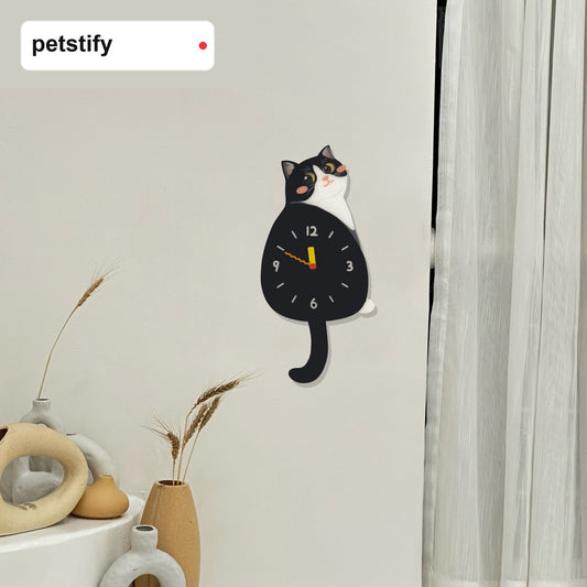 Tuxedo cat wall clock styled as playful cat-themed home decor