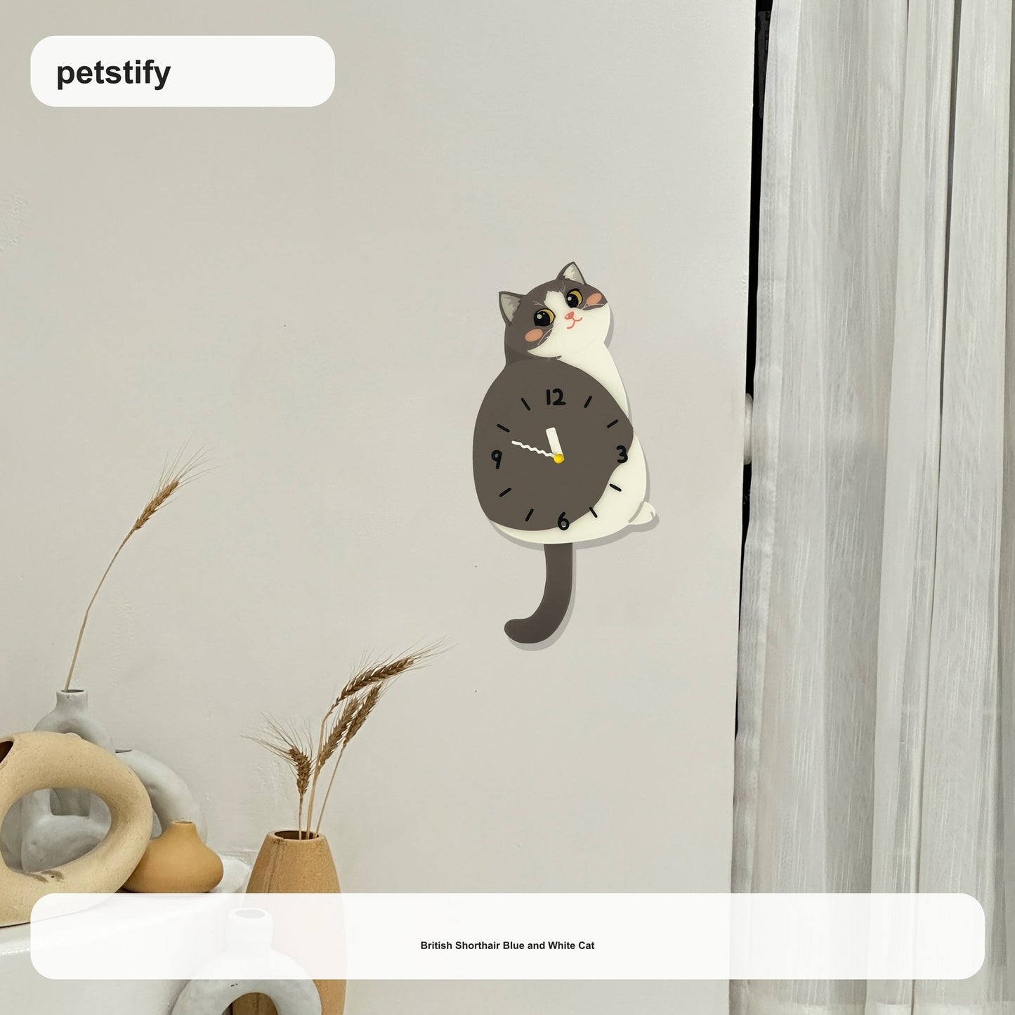 Blue and White Cat Petstify cat wall clock with playful swinging detail